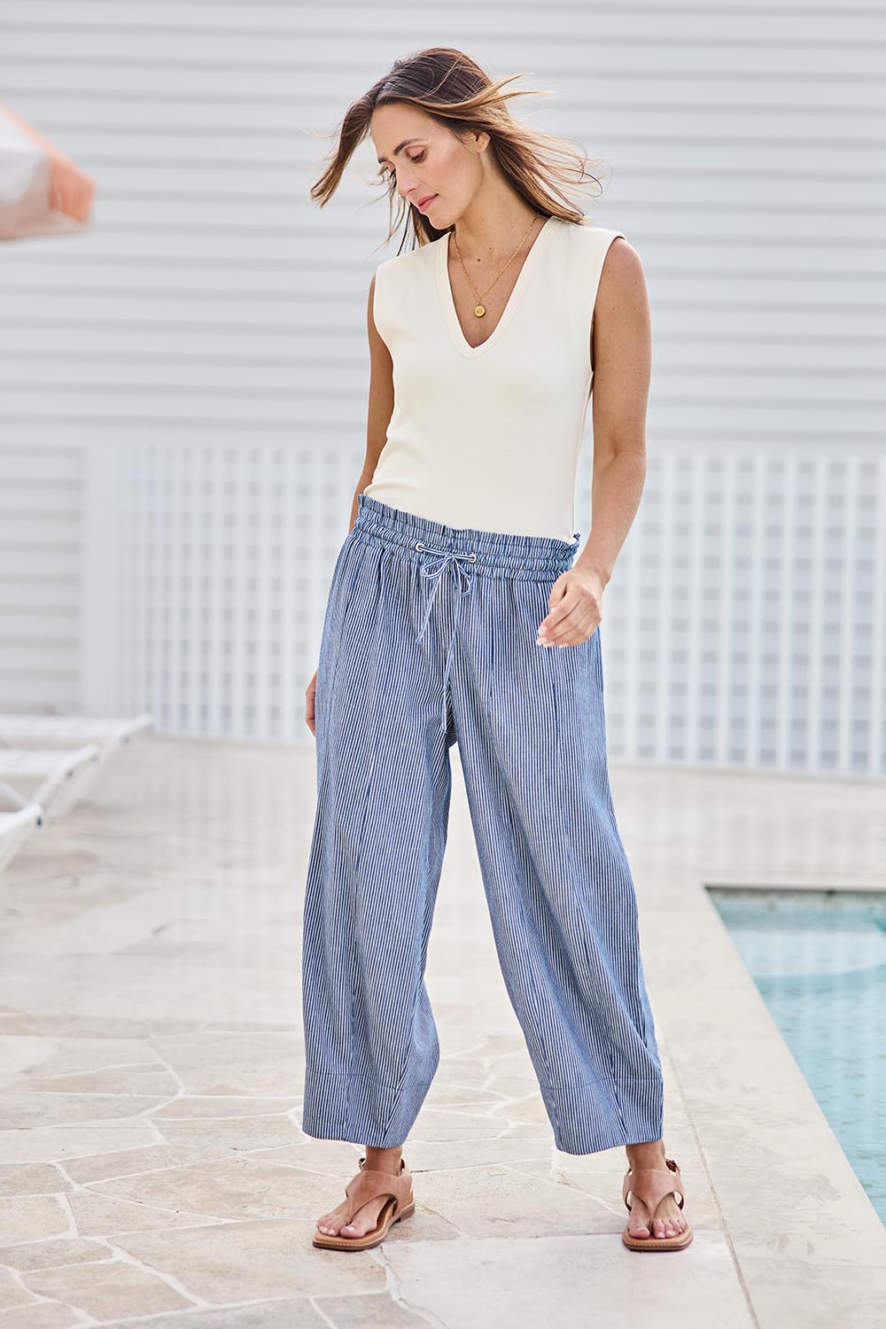 Model Tegand wearing size 10 of the Errand Run Cotton Pull On Pants – Bluestripe in colour Bluestripe, from the front