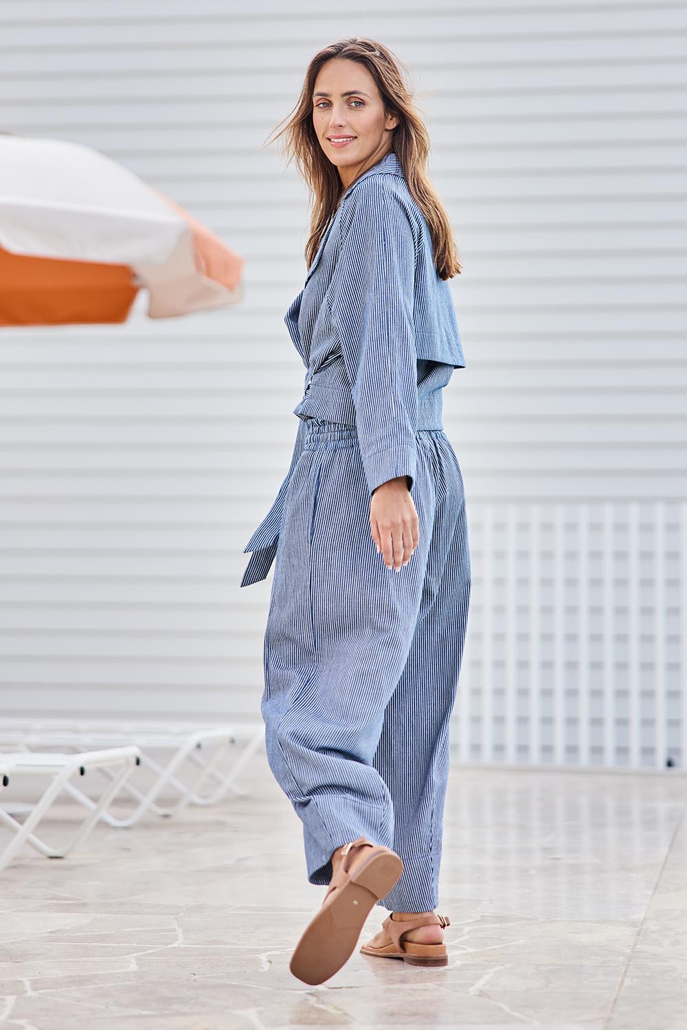 Model Tegand wearing size 10 of the Errand Run Cotton Pull On Pants – Bluestripe in colour Bluestripe, from the front