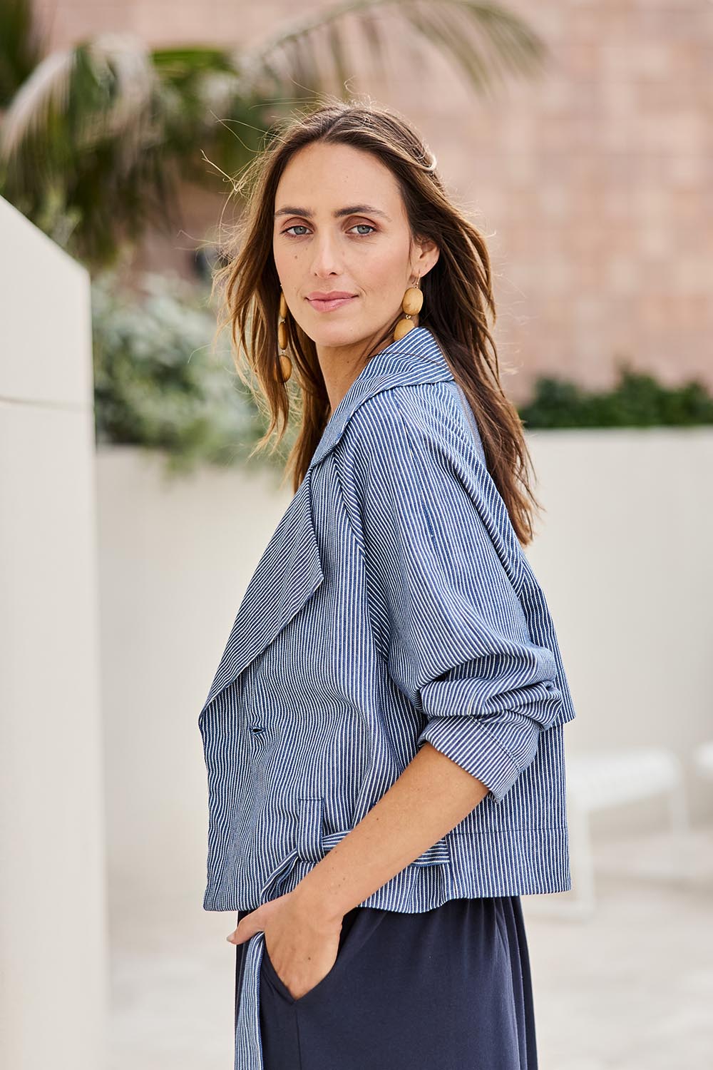 Model Tegand wearing size 10 of the Errand Run Cropped Cotton Trench – Bluestripe in colour Bluestripe, in a cropped view