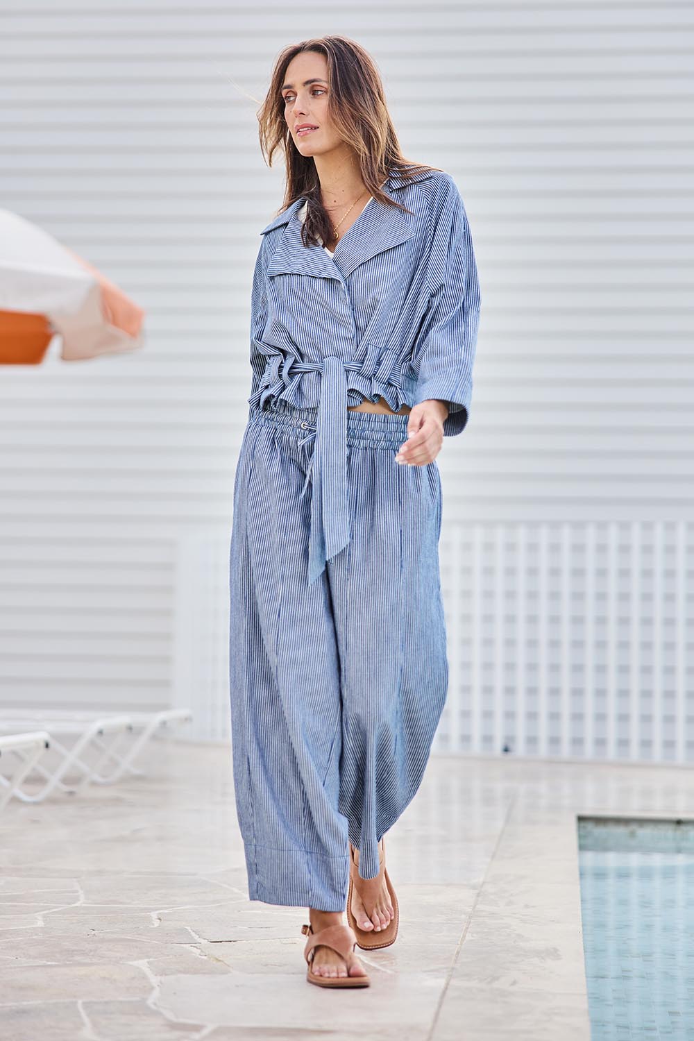 Model Tegand wearing size 10 of the Errand Run Cropped Cotton Trench – Bluestripe in colour Bluestripe, from the front