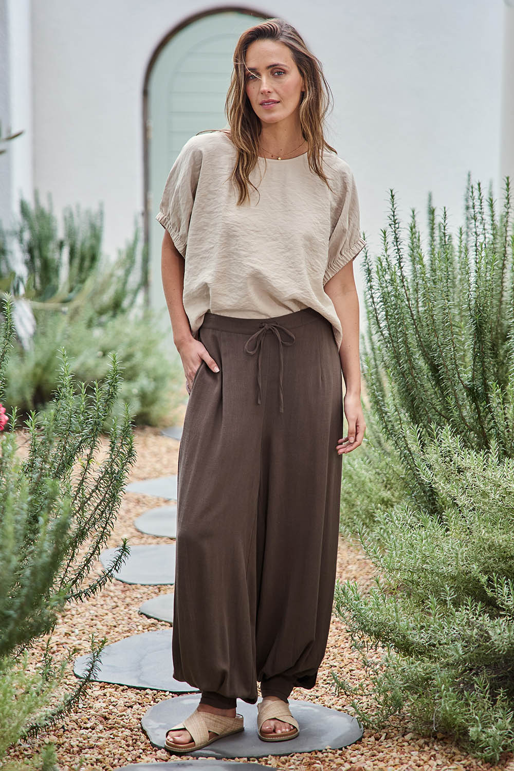 Model Tegand wearing size 10 of the All Day Pull On Balloon Pants - Milkchoc in colour Milkchoc, from the front
