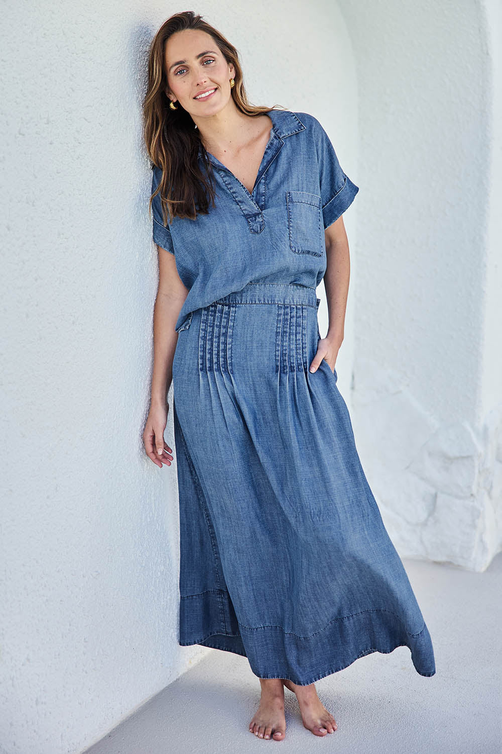 Model Tegand wearing size 10 of the Perfect Day Lyocell Popover Shirt – Denim in colour Denim, from the front