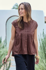 Model Tegand wearing size 10 of the Easy Love Pintuck Cotton Blouse – Chocolate in colour Chocolate, from an angle