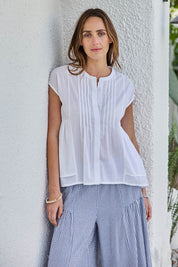 Model Tegand wearing size 10 of the Easy Love Pintuck Cotton Blouse – White in colour White, in a cropped view