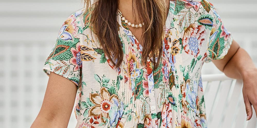 Model Tegand wearing size 10 of the Sunny Day Pleated Short Sleeve Blouse – Fleur in colour Fleur, in a cropped view