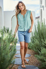 Model Tegand wearing size 10 of the Cute As A Button Fringed Tank – Mint in colour Mint, from the front