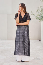 Model Tegand wearing size 10 of the Wear Your Own Way Maxi Dress – Black in colour Black, from the front