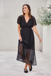 Model Tegand wearing size 10 of the Wear Your Own Way Maxi Dress – Black in colour Black, from the front