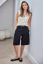 Model Tegand wearing size 10 of the Want You In My Life Long Line Shorts – Black in colour Black, from the front