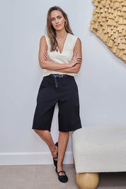 Model Tegand wearing size 10 of the Want You In My Life Long Line Shorts – Black in colour Black, from the front