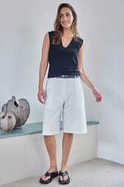 Model Tegand wearing size 10 of the Want You In My Life Long Line Shorts – White in colour White, from the front