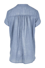 Product shot of the Pleated Delight Cotton Blouse – Denim in colour Denim, from the back