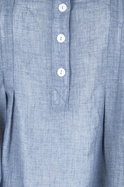 Product shot of the Pleated Delight Cotton Blouse – Denim in colour Denim, showing detail
