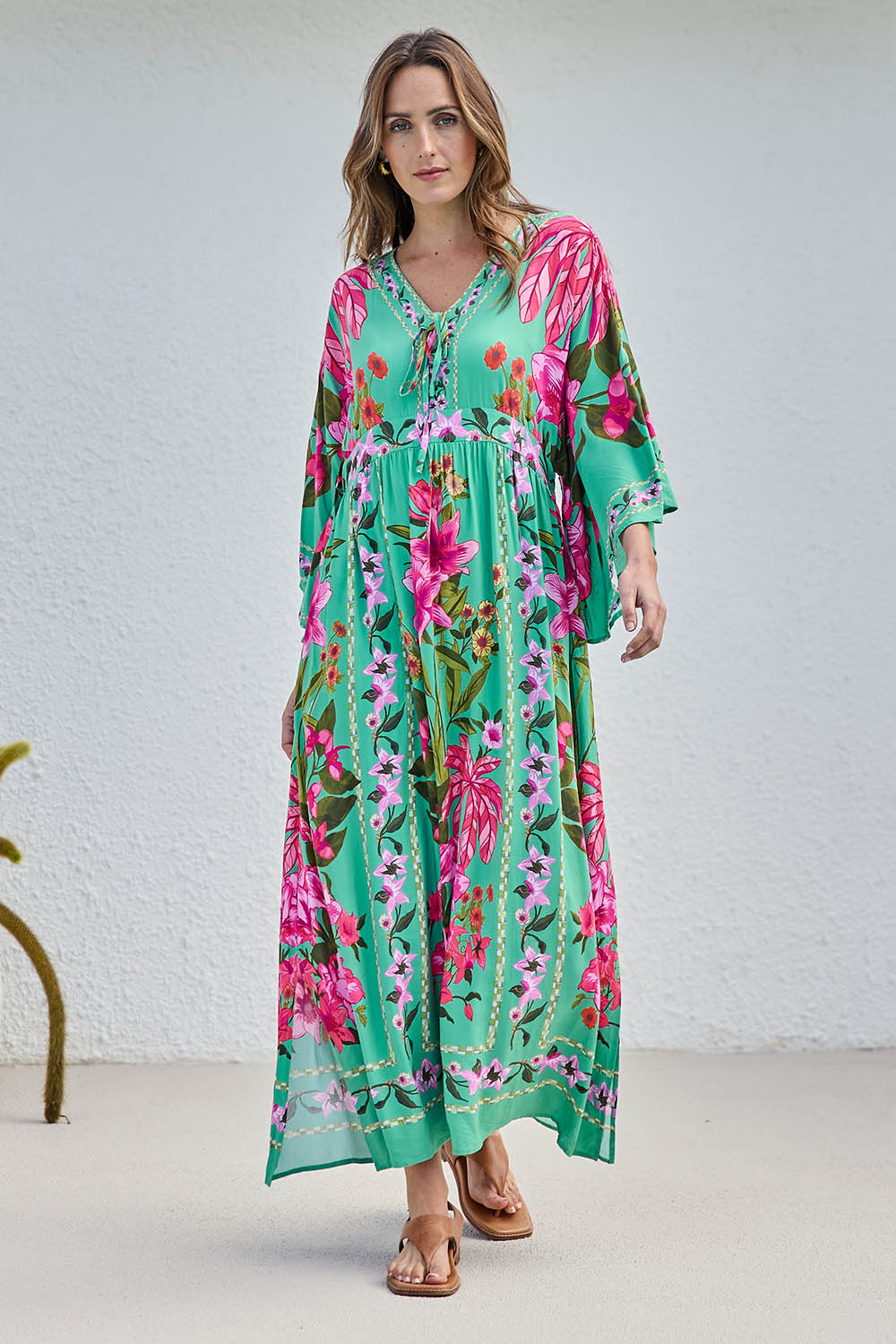 Model Tegand wearing size 10 of the Wild Meadow Maxi Dress - Greenfleur in colour Greenfleur, from the front