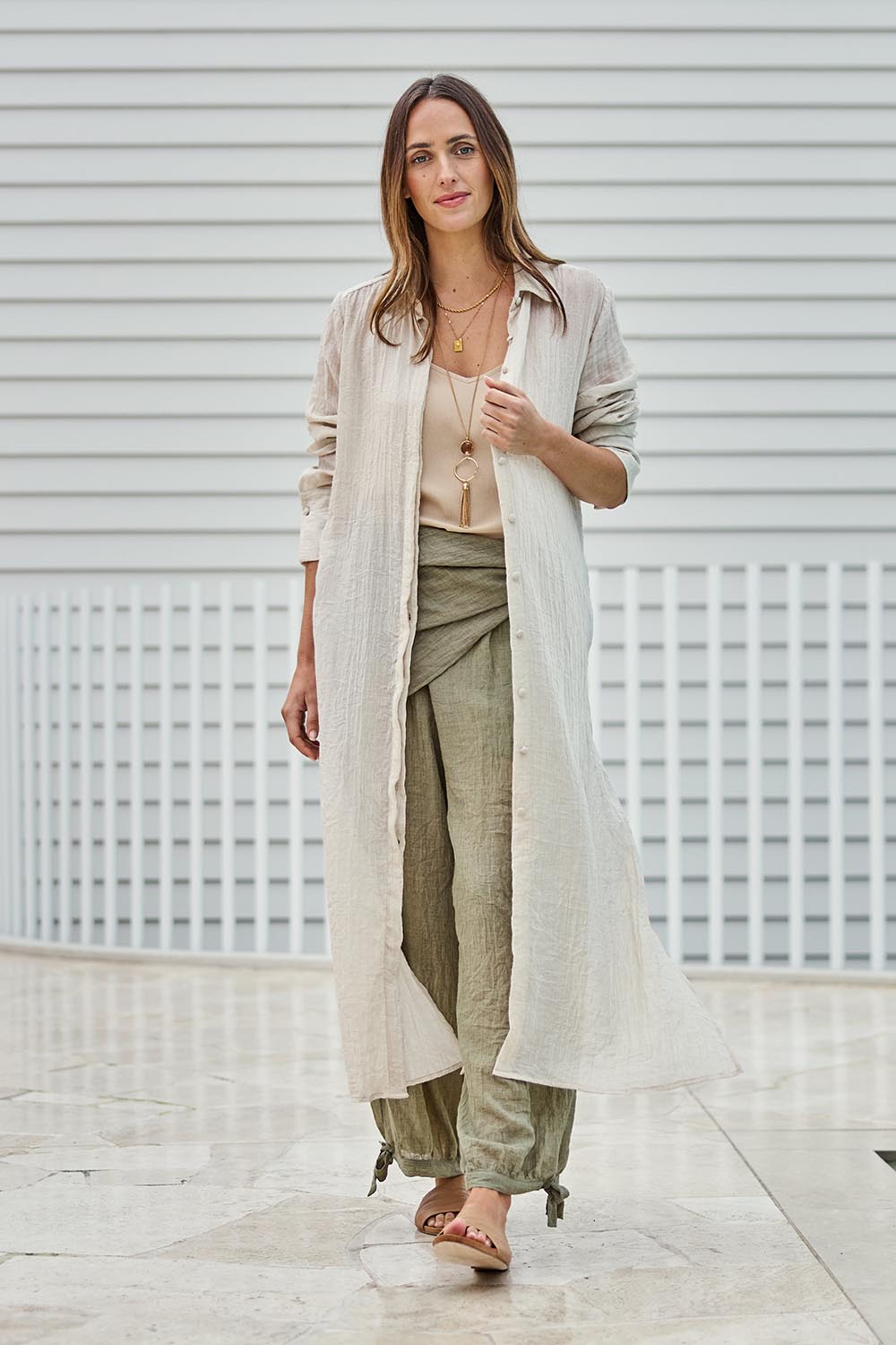 Model Tegand wearing size 10 of the Floating Through The Day Maxi Shirt - Sand in colour Sand, from the front