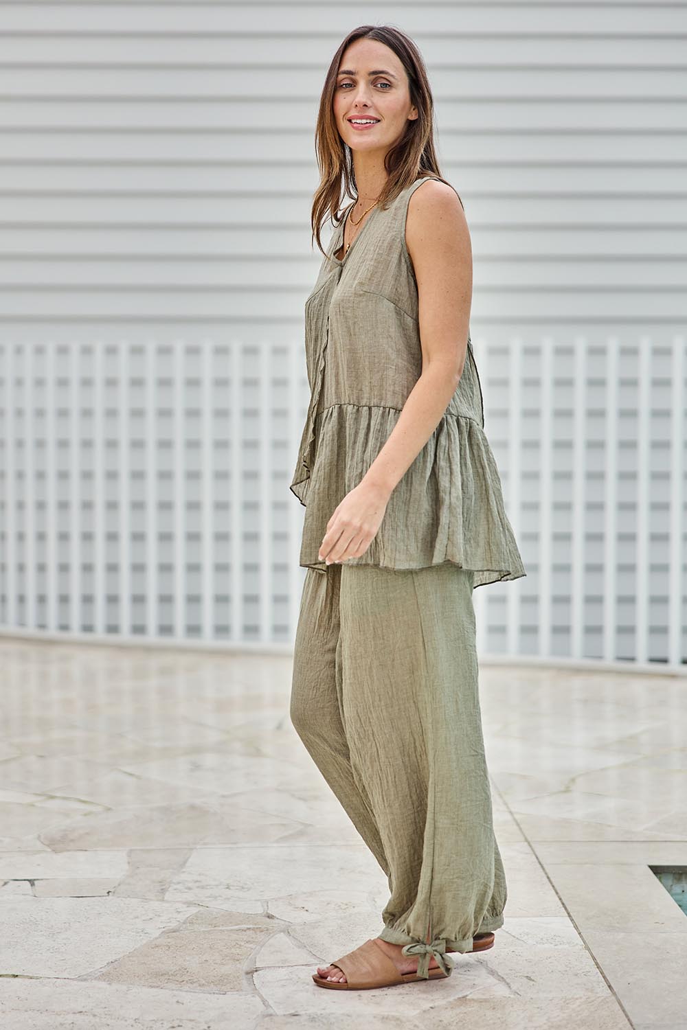 Model Tegand wearing size 10 of the Floating Through The Day Pants  - Olive in colour Olive, from the front