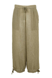 Product shot of the Floating Through The Day Pants  - Olive in colour Olive, from the front