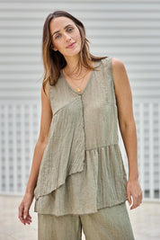 Model Tegand wearing size 10 of the Floating Through The Day Singlet - Olive in colour Olive, in a cropped view