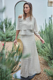 Model Tegand wearing size 10 of the Golden Hour Knit Top And Poncho Set - Natural in colour Natural, from the front