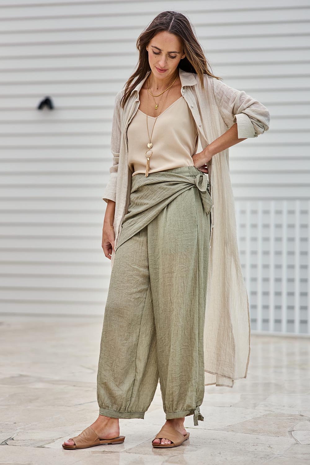 Model Tegand wearing size 10 of the Floating Through The Day Scarf - Olive in colour Olive, from the front
