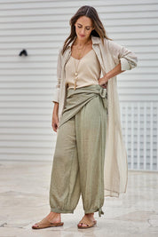 Model Tegand wearing size 10 of the Floating Through The Day Scarf - Olive in colour Olive, from the front