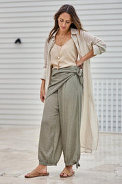 Model Tegand wearing size 10 of the Floating Through The Day Scarf - Olive in colour Olive, from the front