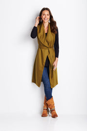 Model Clementine wearing size 8 of the Round Em Up Vest in colour Forest (Green), from the front, showing the whole outfit
