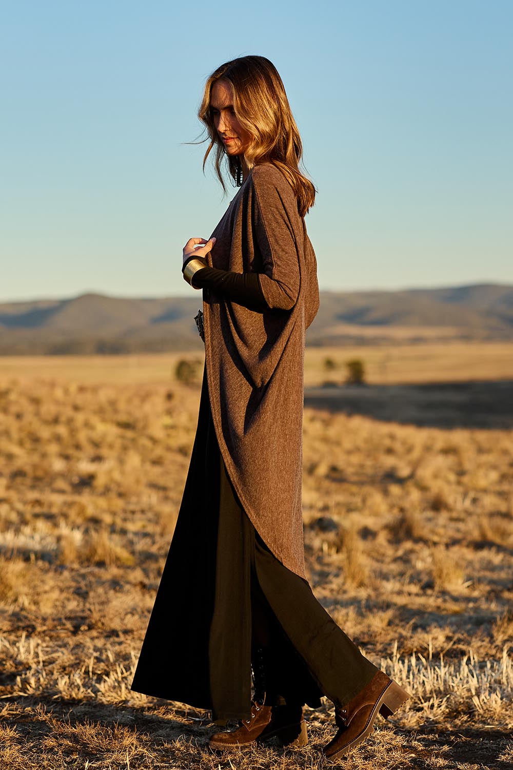 Model Tegan wearing size 10 of the Falling For You Cardi in colour Chocolate, from the front, showing the whole outfit