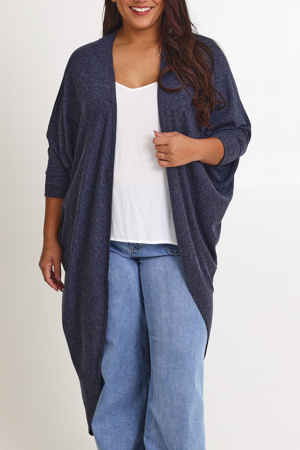 Model Ashleigh wearing size 16 of the Falling For You Cardi in colour Denim (Blue), from the front, cropped image