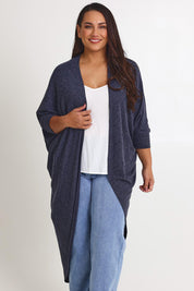Model Ashleigh wearing size 16 of the Falling For You Cardi in colour Denim (Blue), from the front, cropped image