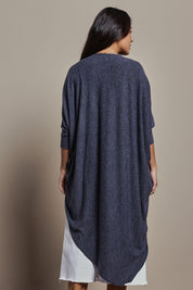 Model Tahnee wearing size 10 of the Falling For You Cardi in colour Denim (Blue), from the back