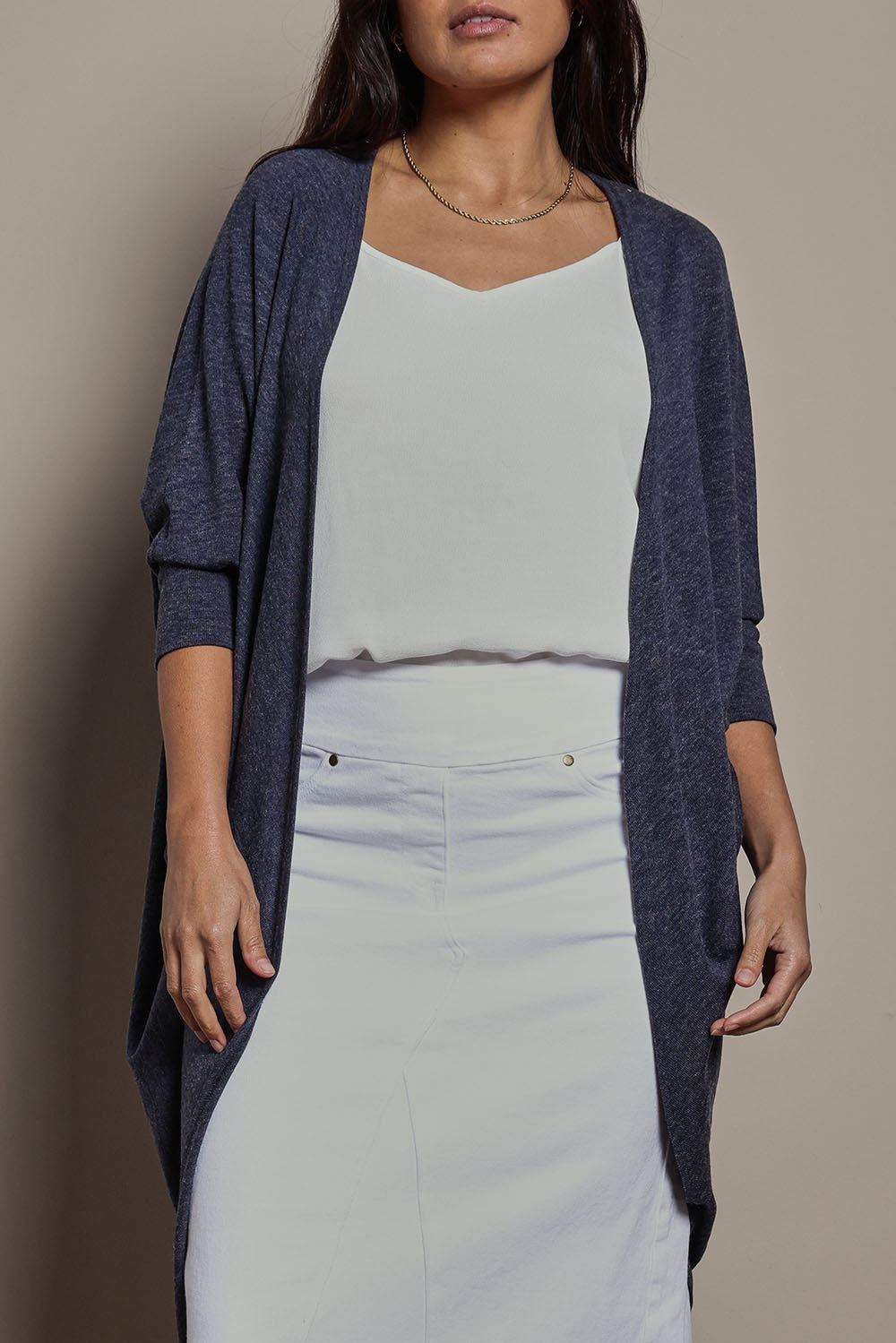 Model Tahnee wearing size 10 of the Falling For You Cardi in colour Denim (Blue), from the front, cropped image