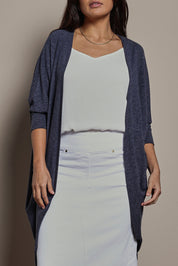 Model Tahnee wearing size 10 of the Falling For You Cardi in colour Denim (Blue), from the front, cropped image