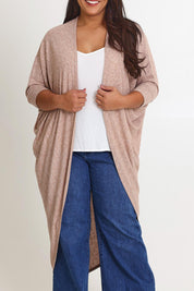 Model Ashleigh wearing size 16 of the Falling For You Cardi in colour Natural, from the front, cropped image