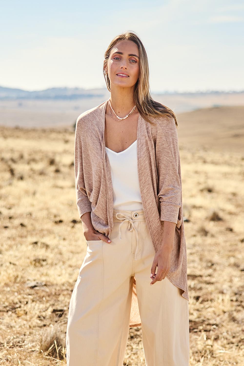Model Larissa wearing size 10 of the Falling For You Cardi in colour Natural, from the front, showing the whole outfit
