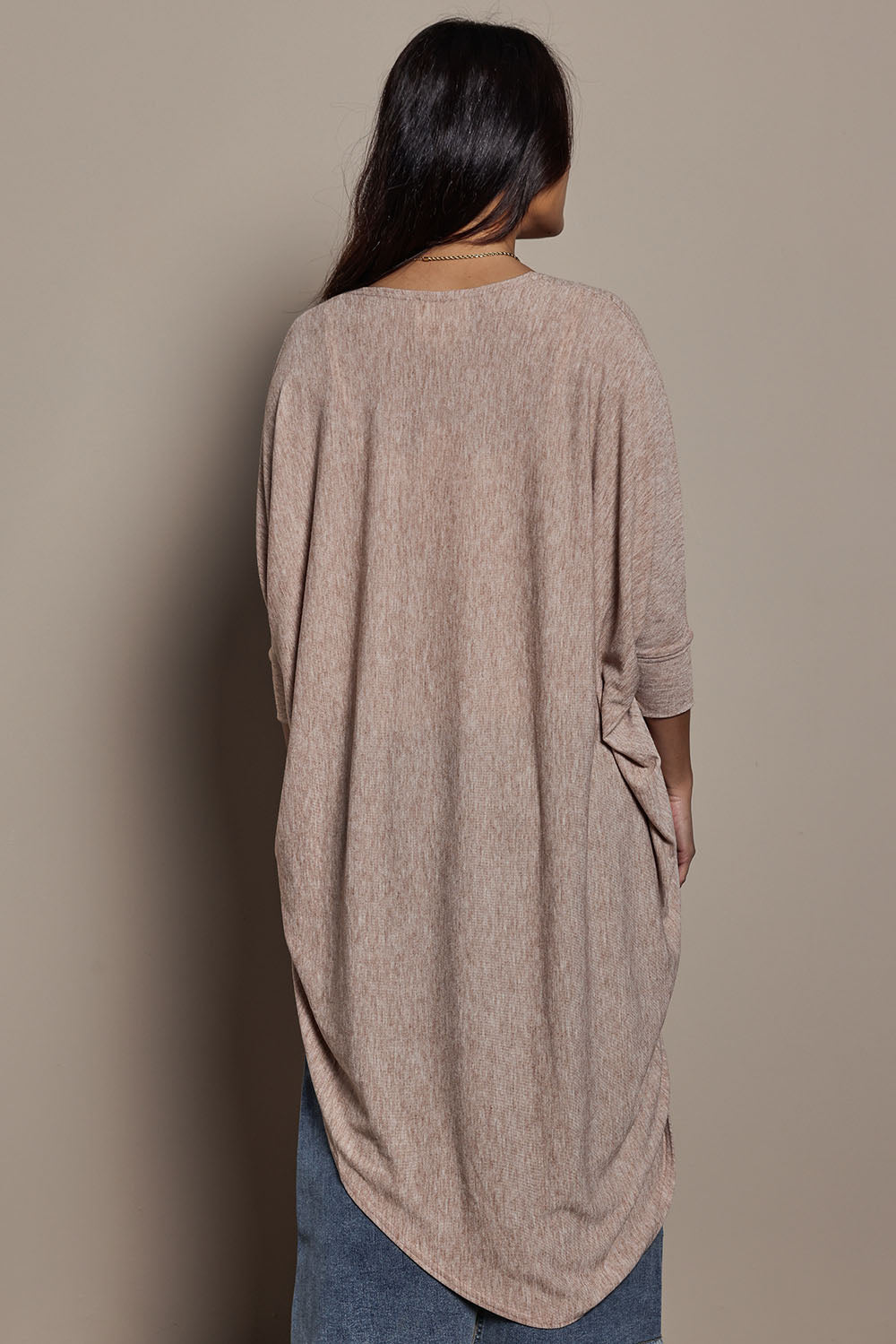 Model Tahnee wearing size 10 of the Falling For You Cardi in colour Natural, from the back
