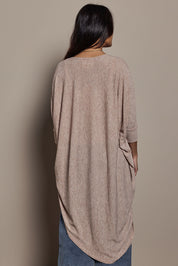 Model Tahnee wearing size 10 of the Falling For You Cardi in colour Natural, from the back
