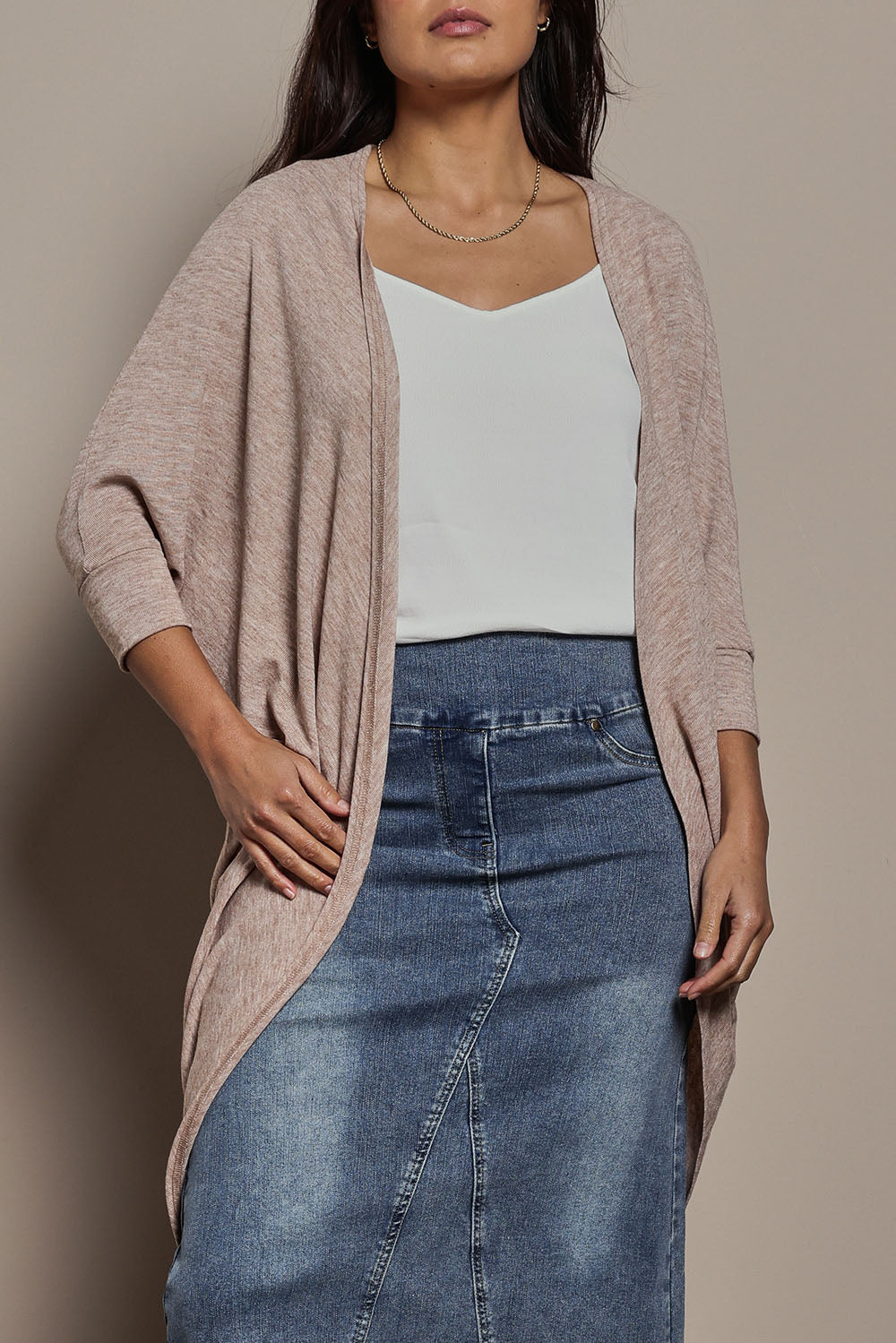 Model Tahnee wearing size 10 of the Falling For You Cardi in colour Natural, from the front, cropped image
