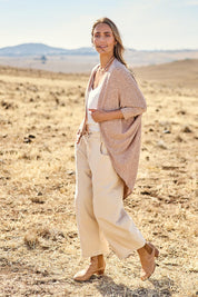 Model Tegan wearing size 10 of the Falling For You Cardi in colour Natural, from the front, showing the whole outfit