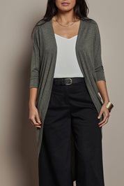 Model Tahnee wearing size 10 of the Falling For You Cardi in colour Pine (Green), from the front, cropped image
