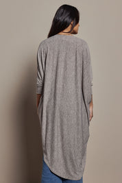 Model Tahnee wearing size 10 of the Falling For You Cardi in colour Rock, from the back