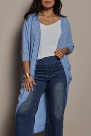 Model Tahnee wearing size 10 of the Falling For You Cardi in colour Sky (Blue), from the front, cropped image