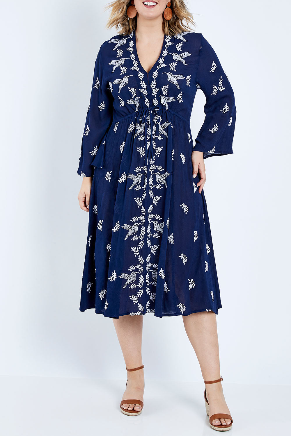 Model Jess wearing size 14 of the Dancing With Birds Midi Dress in colour Deepblue (Blue), from the front, cropped image