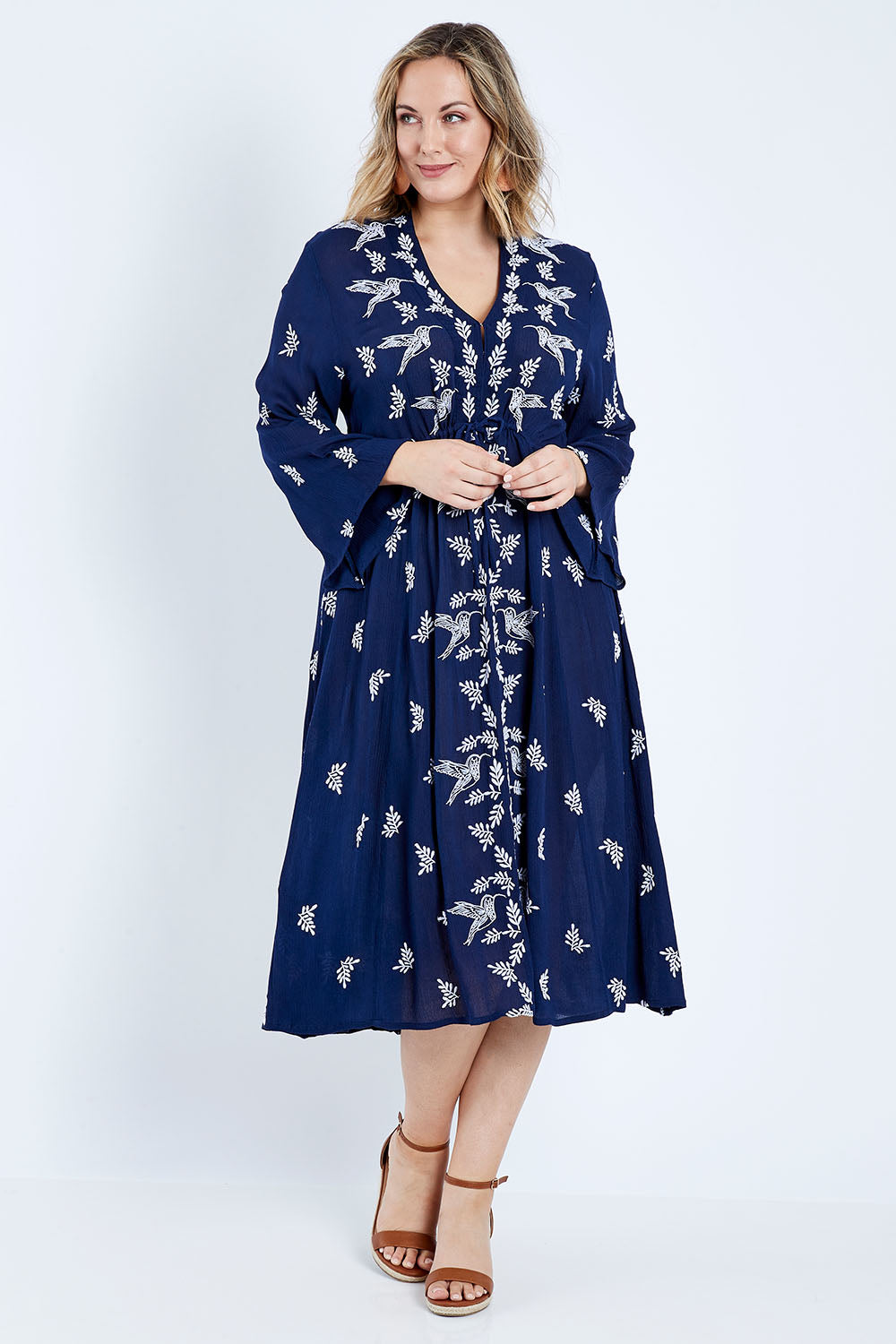 Model Jess wearing size 14 of the Dancing With Birds Midi Dress in colour Deepblue (Blue), from the front, showing the whole outfit