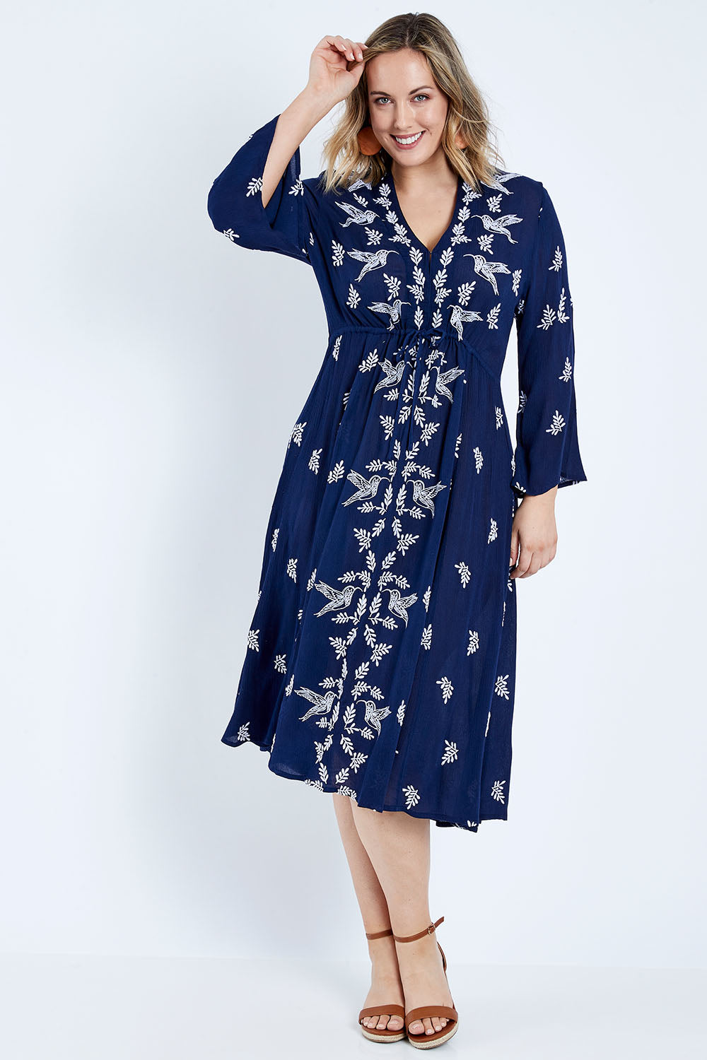 Model Jess wearing size 14 of the Dancing With Birds Midi Dress in colour Deepblue (Blue), from the front, showing the whole outfit
