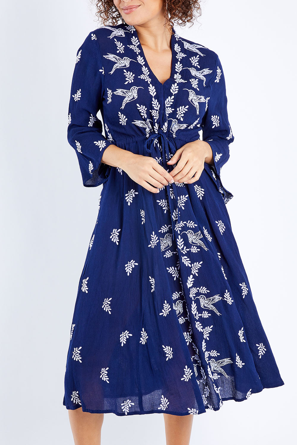 Model Lala wearing size 10 of the Dancing With Birds Midi Dress in colour Deepblue (Blue), from the front, cropped image