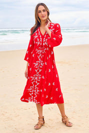 Model Tegan wearing size 10 of the Dancing With Birds Midi Dress in colour Scarlet (Red), from the front, showing the whole outfit