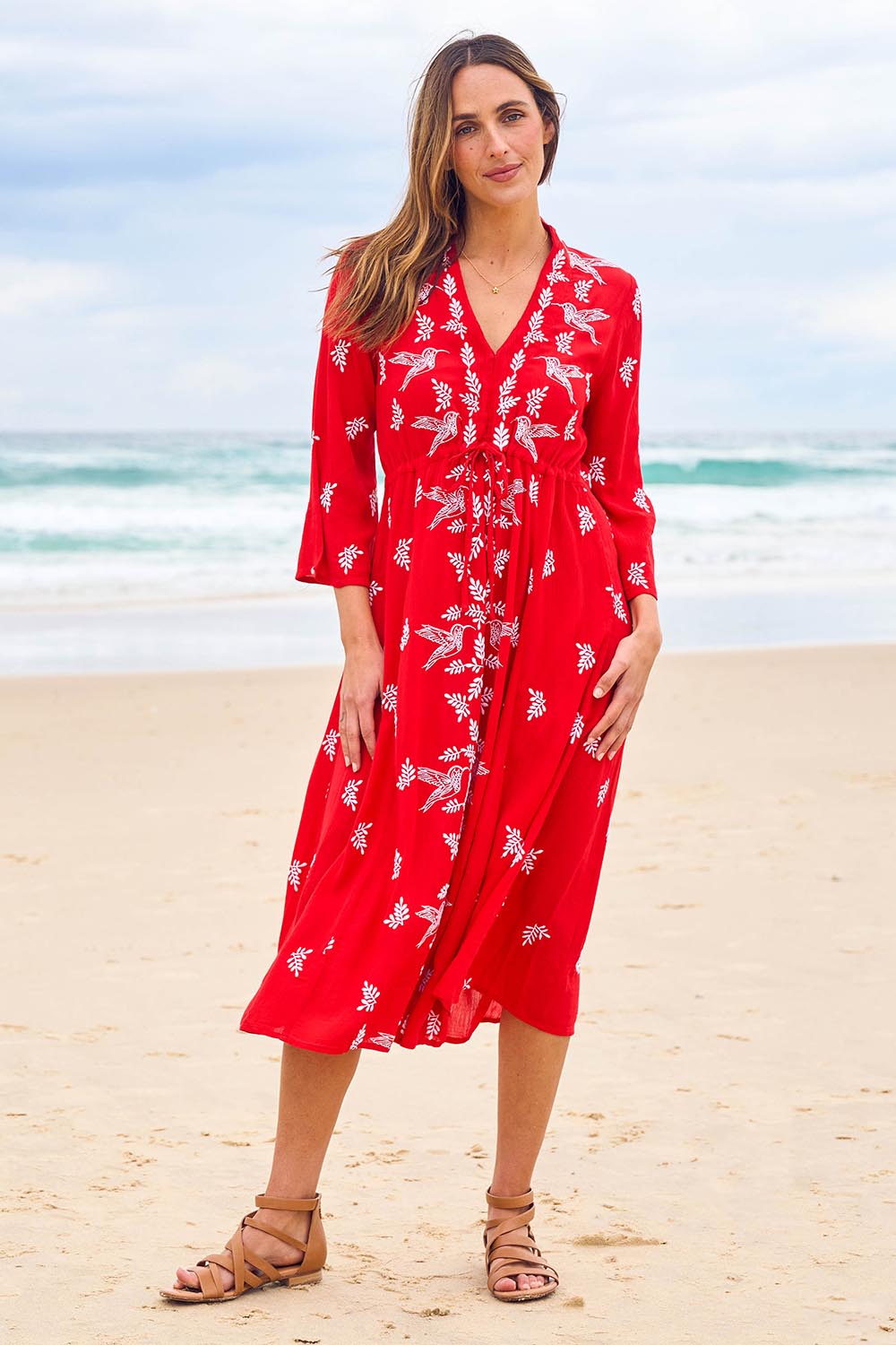 Model Tegan wearing size 10 of the Dancing With Birds Midi Dress in colour Scarlet (Red), from the front, showing the whole outfit