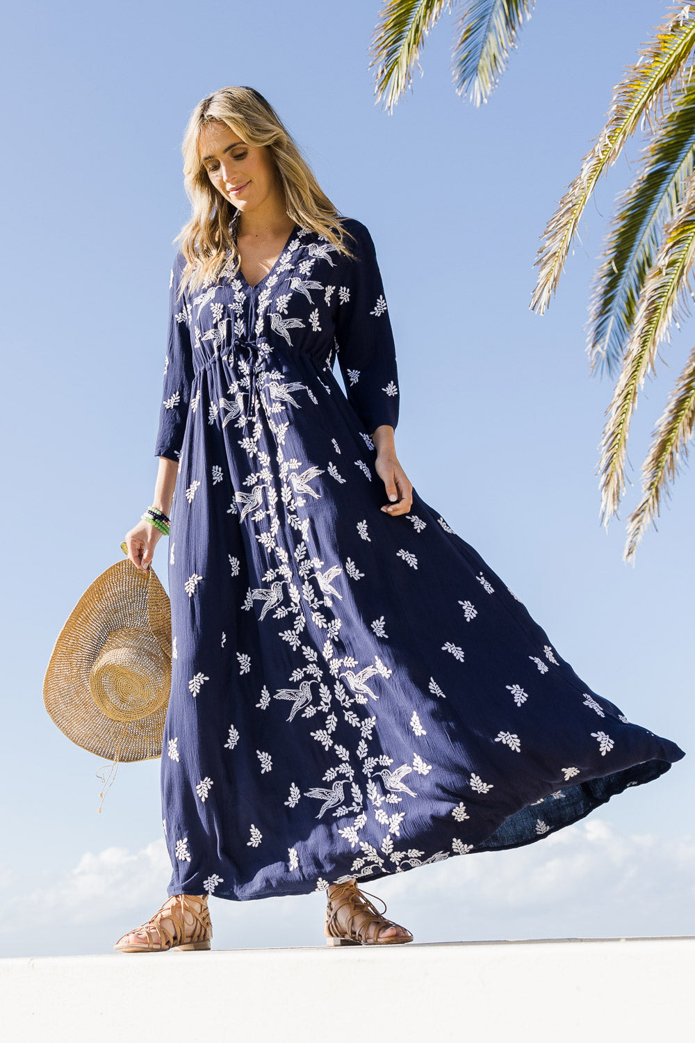 Model Tegan wearing size 10 of the Dancing With Birds Dress in colour DeepBlue (Blue), from the front, showing the whole outfit