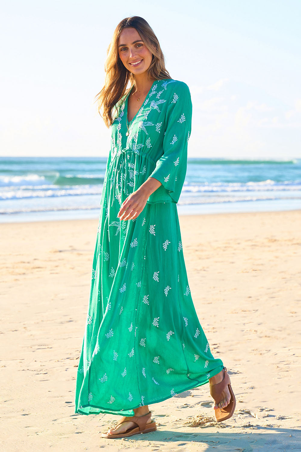 Model Lala wearing size 10 of the Dancing With Birds Dress in colour Emerald (Green), from the front, showing the whole outfit